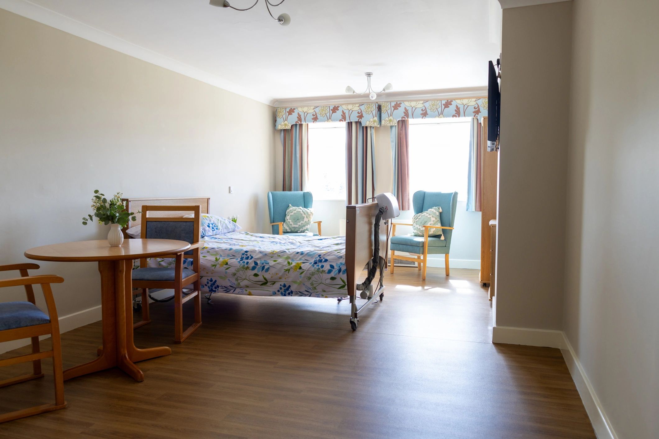 Well-styled cozy bedroom representing customer comfort